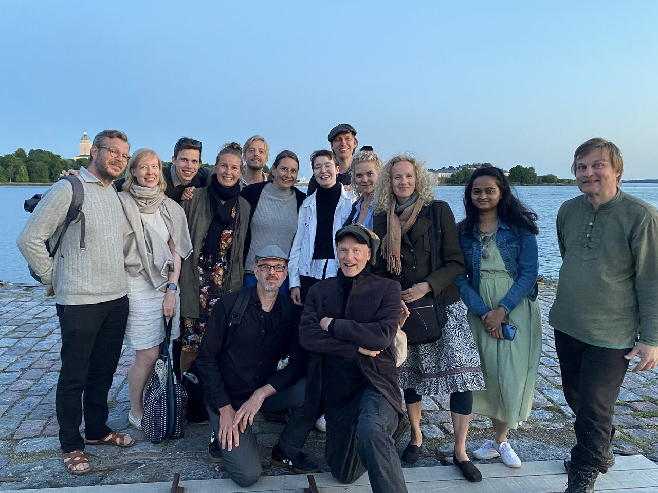 A group of people by the sea.