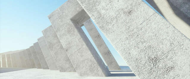 Betonirakenteita, taustalla meri.