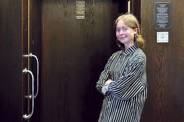 A woman is looking at the camera