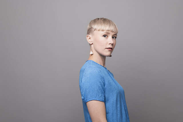 A woman is looking at the camera