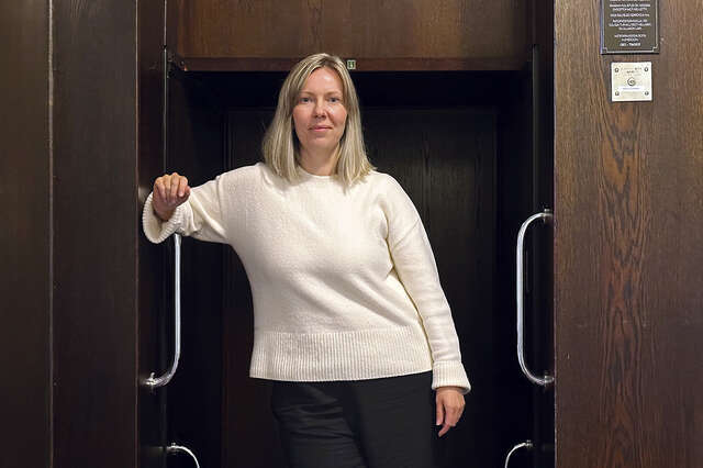 A woman is looking at the camera