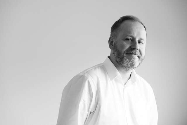 A black-and-white photograph of a man.