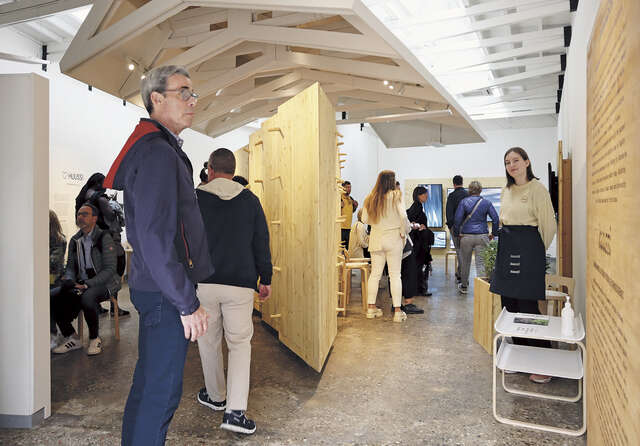 An exhibition space with lots of people.