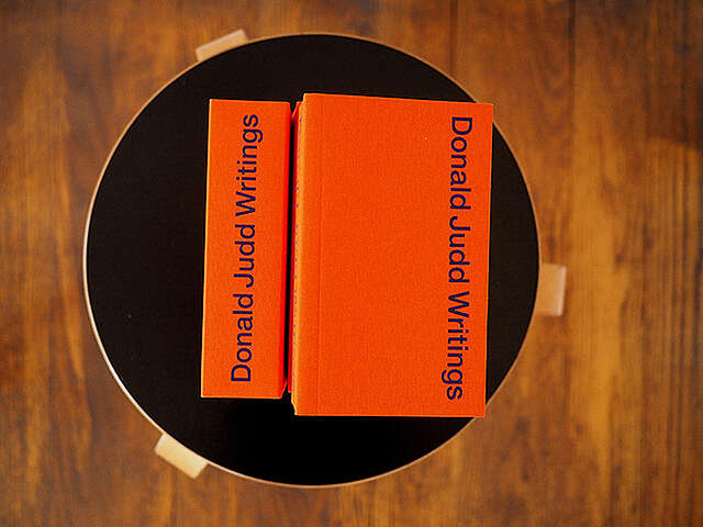 Donald Judd's books on a stool.