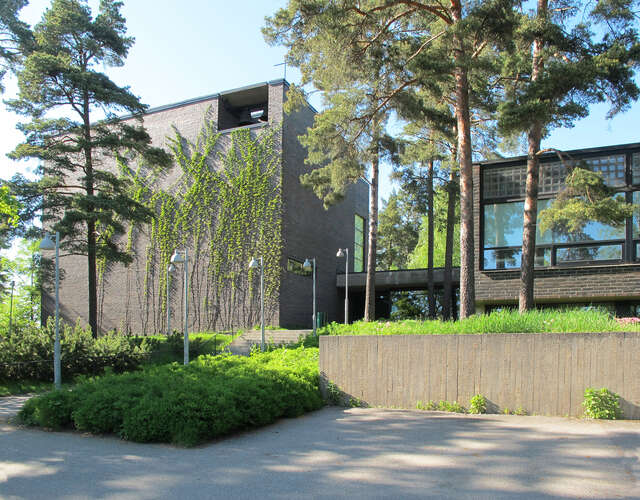 modern church building made of bricks in the summer during sunny weather