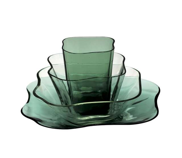Green glass bowls and platters in organic, round shapes