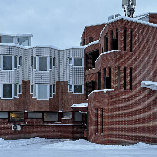 Senior Centre Himmeli's brick facade during winter.