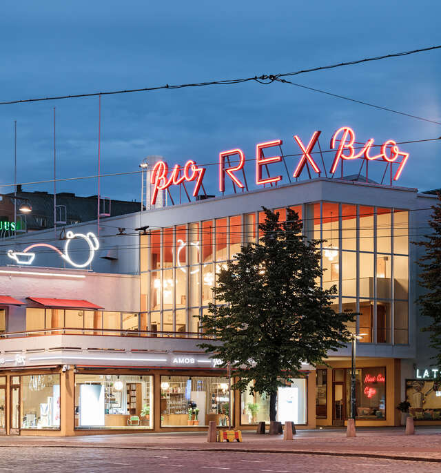 A functionalist style building with neon lights stating Bio Rex