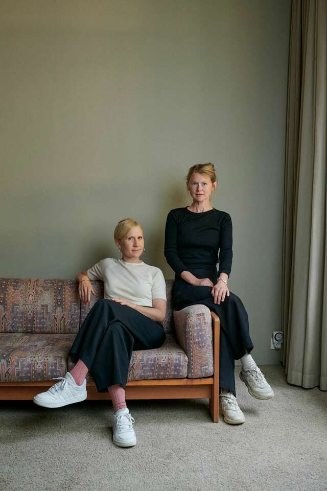 Two women are looking at the camera