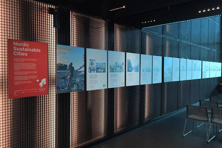 Exhibition material lined up on a wall. 